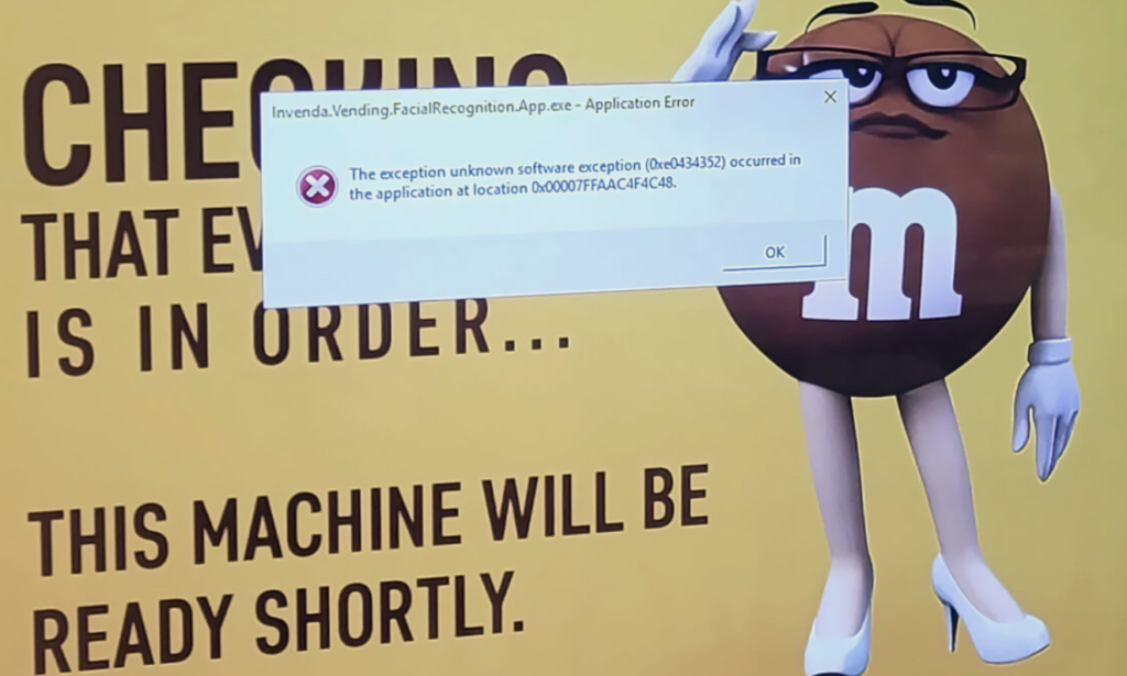 Photo of M&Ms vending machine with  facial recognition error code