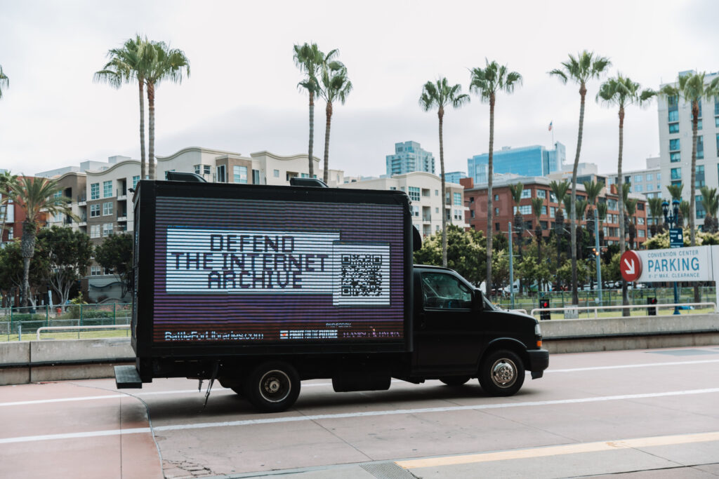 A truck displaying a mobile billboard that says "Defend the Internet Archive".